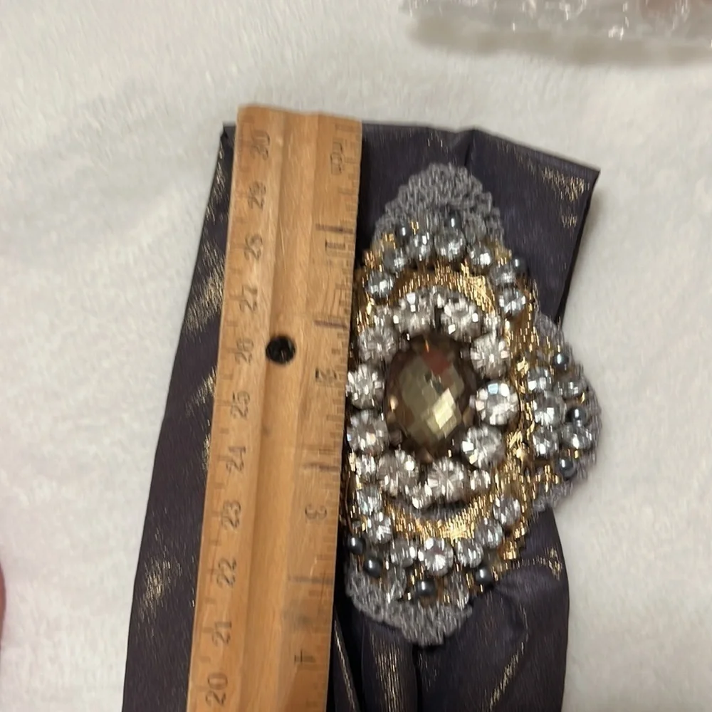 Headband, sparkling fabric and stunning brooch